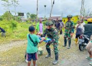 Berbagi Semangat Persaudaraan, TNI Marinir Disambut Gembira Warga Kuaserama